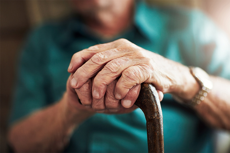 old man holding his cane