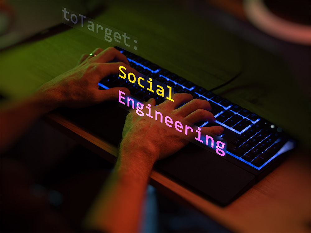 Ръце върху клавиатура с надпис „Social Engineering“.